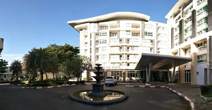 Exterior of the complex featuring the Royal Place entrance, fountain, and its curved white facade